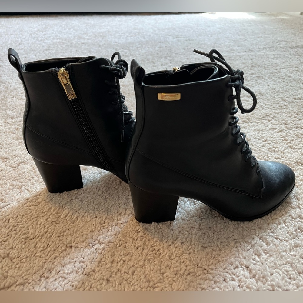 Calvin Klein black leather, lace-up, heeled booties. Size 5.